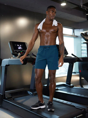 Full-body gym view of model in BLUE INDIGO 2 in 1 Running Sports Shorts with Liner