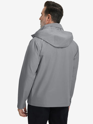 Back view of model in lightweight water-repellent softshell hooded jacket showing fit and structure in neutral grey.