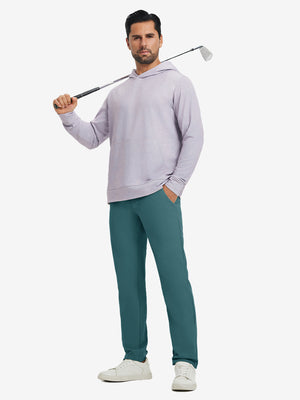 Model holding a golf club on shoulder, wearing dark teal water-resistant golf stretch nylon pants.
