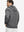 Back view of model wearing texture solid hoodies pullover showing fit and hood detail, black heather.