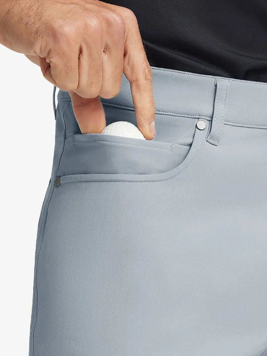 GLACIER GREY 4-way Stretch Performance Solid Shorts, front pocket holding golf ball detail, 7 Inch