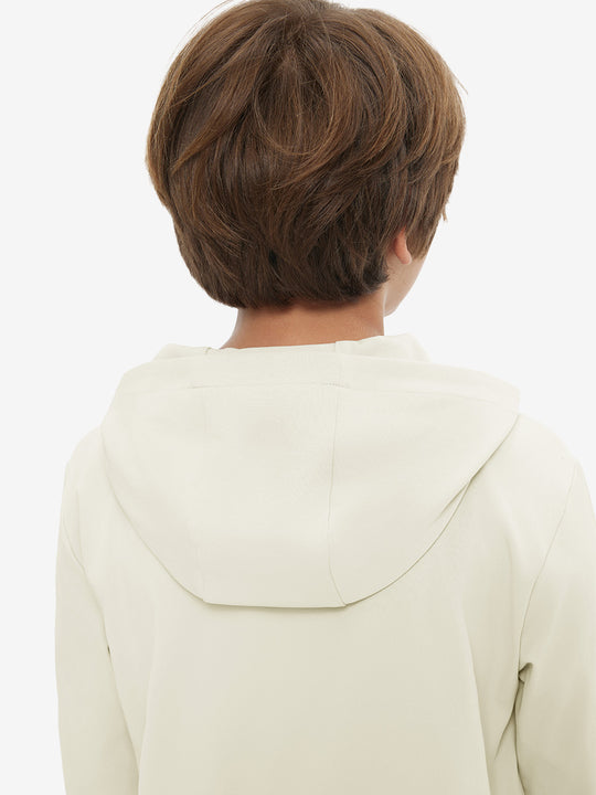 Back upper view of youth long sleeve hoodied with kangaroo pocket in cream, showing fit and shoulders.
