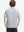 Back upper body of model in trendy boys stripe polo shirts, showing silhouette and ight grey stripe tone
