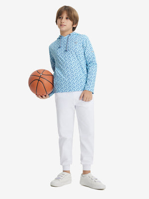 Model playing basketball, wearing blue dinosaur youth full print stylish hoodies pullover in full-body view.