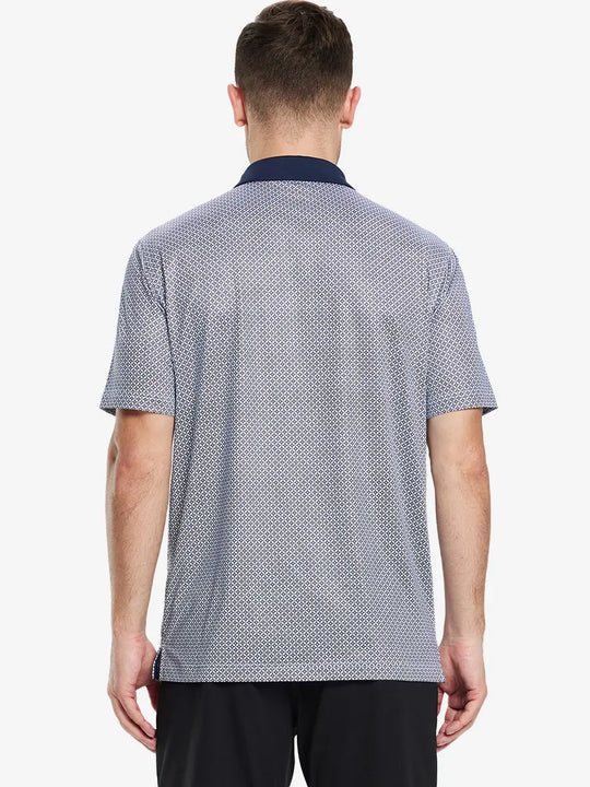 From the back, the model shows the back design of the WHITE NAVY INTERLINK  Polo shirt, clearly showing the shape and cut of the garment