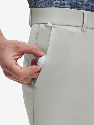 Detail view of front pocket on silver gray flat front golf joggers pants with belt loops