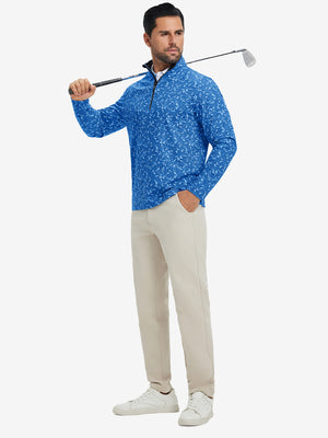 Full-body shot of model holding golf club, dressed in full print quarter zip pullover in line animal.