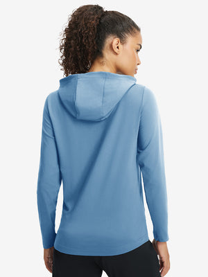 Back upper view of model in women's lightweight hoodies pullover, showing relaxed fit in misty blue.