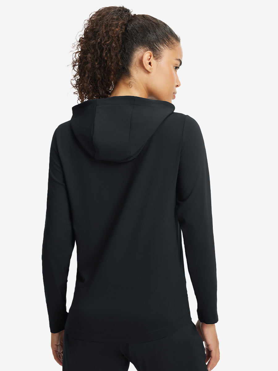 Back upper view of model in women's lightweight hoodies pullover, showing relaxed fit in black.