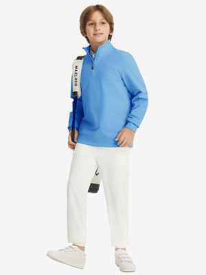 Full body model carrying a golf bag, wearing youth winter micro-fleece quarter zip pullover in sky blue