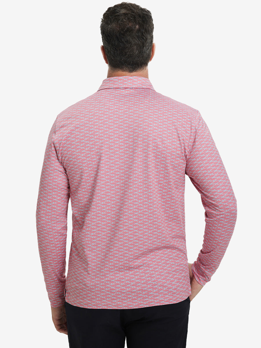 Back upper body view of the lightweight print polo in pink small fish, model turns slightly with relaxed pose.