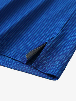 Hem slit detail close-up on COBALT Elegant Performance Jacquard Polo