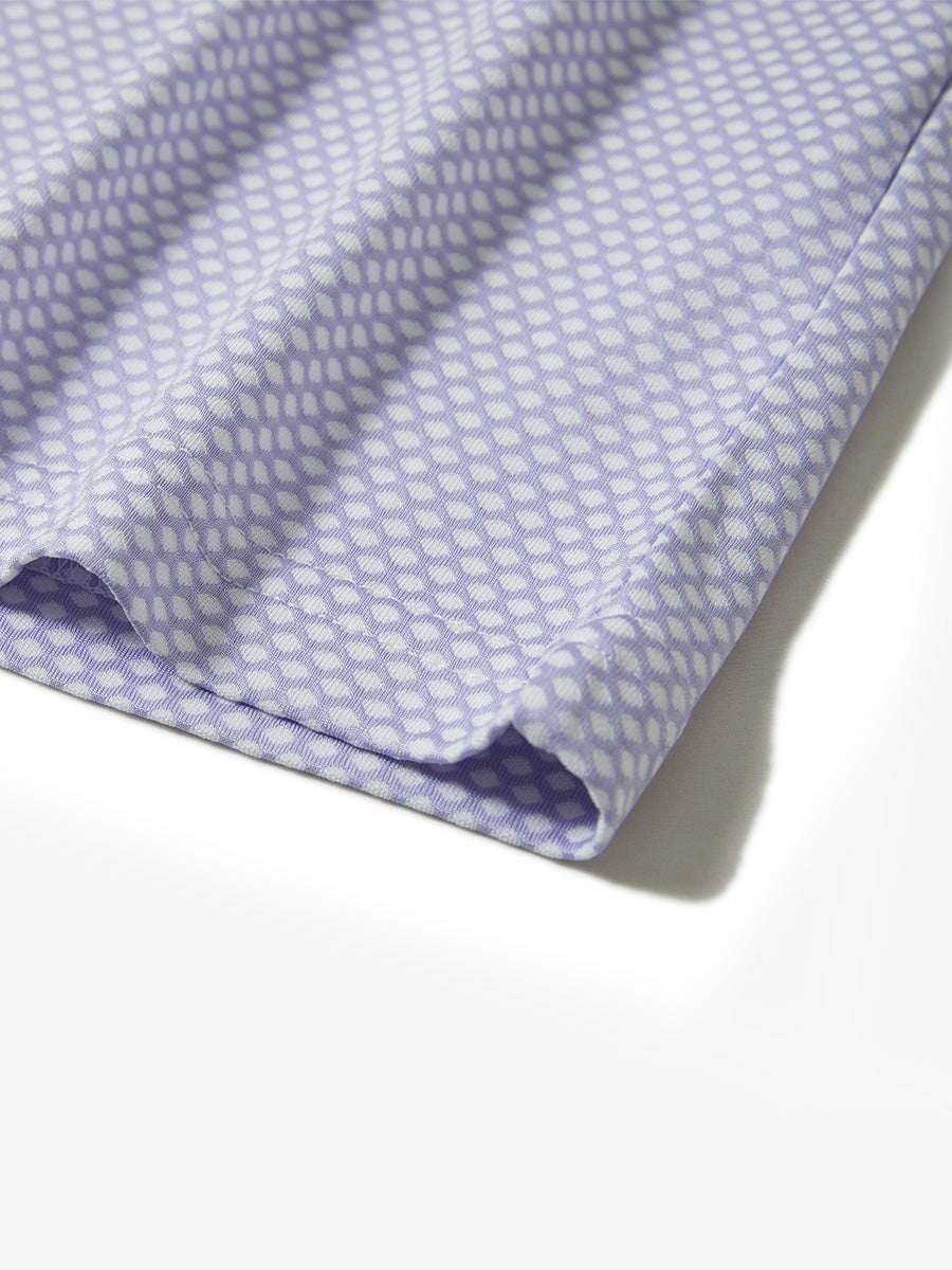 Hem detail of jacquard quarter zip pullover in lavender, focusing on stitching and side vent finish.