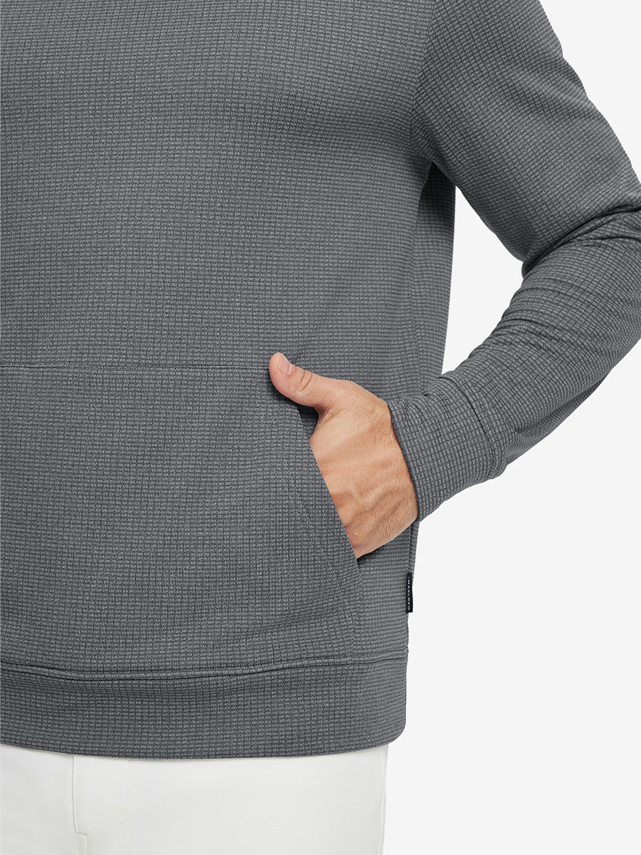 Close-up of model with both hands in pockets wearing warm fleece golf hoodies pullover grey.