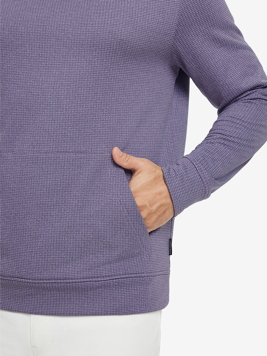 Close-up of model with both hands in pockets wearing warm fleece golf hoodies pullover purple.