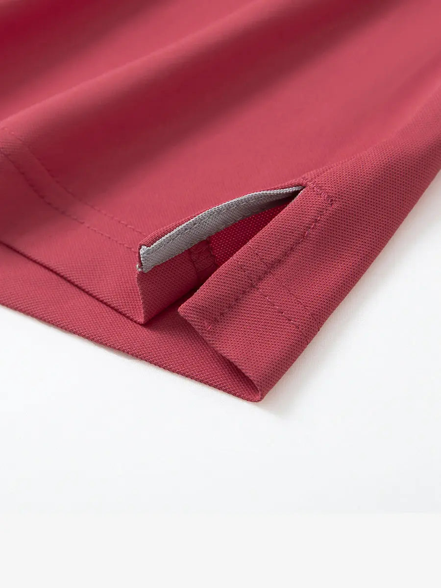 Detail shot of hem opening on BRICK Ventilated Pique Performance Polo