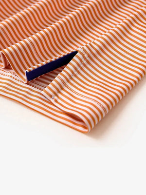 Hem slit detail – Orange Stripe Performance Cooling Polo for youth