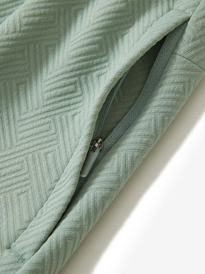 Detail of zipper pocket on soft sweatpants with 4 zipper pockets in beryl green