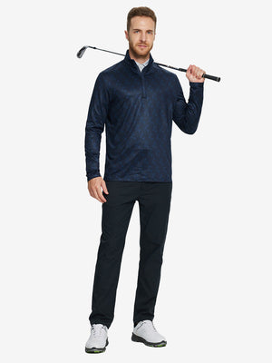 Man wearing Heather Pinstripe Brushed Dry Fit Quarter Zip Pullover in navy geo, holding golf club on course