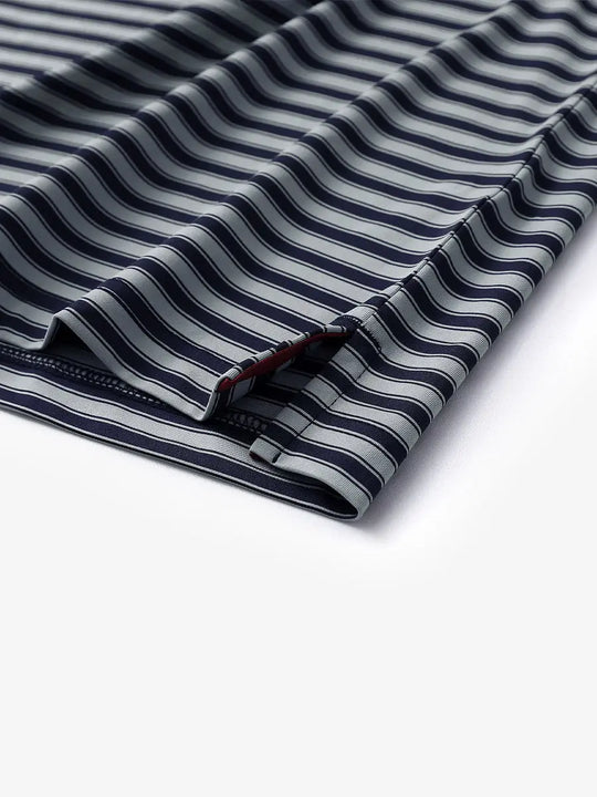 Detailed shot of the hem slit on the Navy Grey Yarn Dyed Stripe Polo – subtle craftsmanship