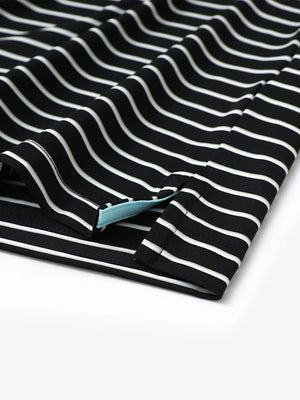 Close-up of side slit hem on BLACK/WHITE STRIPE Polo with crisp finishing