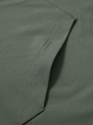 Close-up of single pocket detail on youth long sleeve hoodied with kangaroo pocket in olive green, showing stitching.