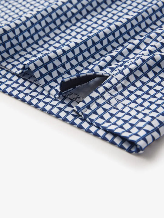 Detailed image shows the corner opening of the navy blue flagpole patterned model polo shirt, simple design and high quality fabric show classic sporty style.
