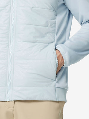 Hand in single pocket detail of the Glacier Grey Golf Fleece Winter Jacket, soft thermal material.
