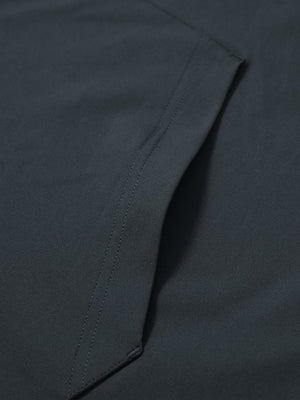 Close-up of single pocket detail on youth long sleeve hoodied with kangaroo pocket in dark grey, showing stitching.