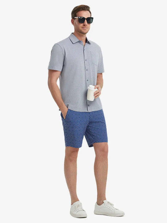 Full-body view of model holding takeaway drink cup in DARK BLUE HEATHER Cotton Blend Plain Shirt.