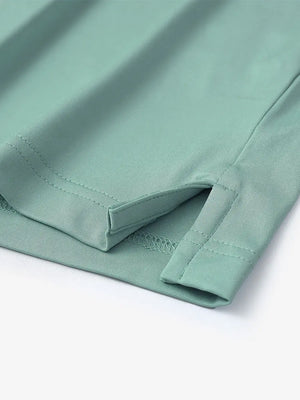 Hem slit detail of Everyday Collarless Jersey Shirt in BERYL GREEN.