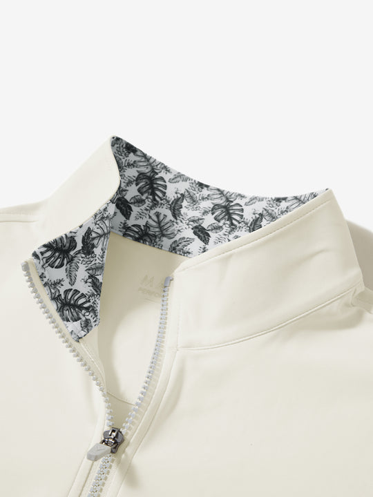 Collar zipper and inner neck pattern detail of the lightweight golf quarter zip pullover in cream.