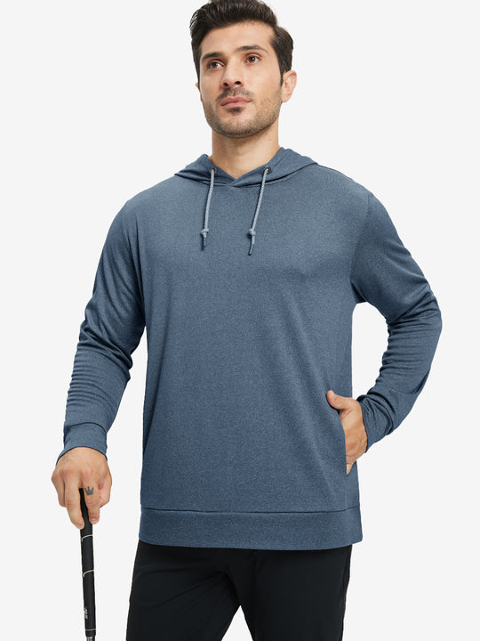 Model with one hand in pocket, wearing classic heather pullover hoodie in navy melange, relaxed look.