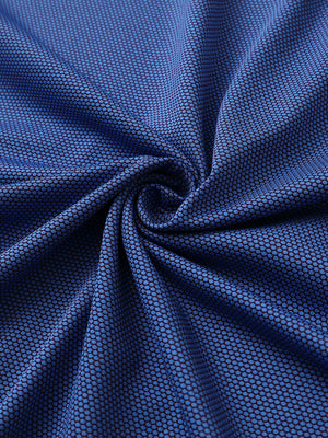 Close-up of plum blue performance ananas jacquard polo fabric showing refined texture.