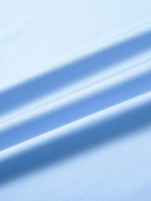 Close-up of light blue long sleeve solid jersey polo fabric texture showing soft knit and smooth finish details.