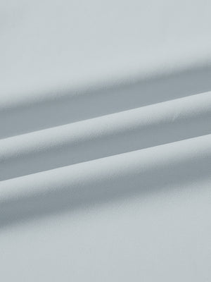 Fabric close-up of print collar quarter zip golf vest, smooth material with subtle texture in misty grey