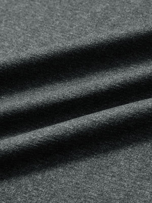 Close-up of classic heather pullover hoodies with 2 pocket fabric in black melange, soft knit texture