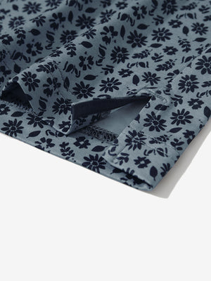 Detail: hem slit of grayish blue flower stretch printed collarless henley golf shirts