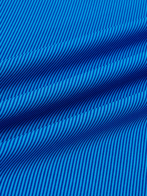 Close-up fabric view of long sleeve pinstripe jersey polo, smooth knit with subtle cobalt stripe stripes