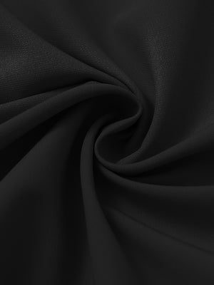 Fabric detail of Windproof golf vests with zip pockets showing smooth texture in black