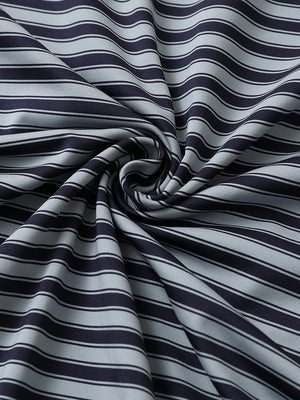 Close-up of navy grey yarn dyed stripe polo fabric showing distinct woven stripes and textured surface.