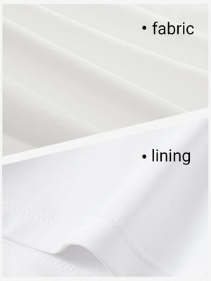 Close-up texture of white women's moisture-wicking athletic tennis skirts fabric showing detailed outer and inner lining material.