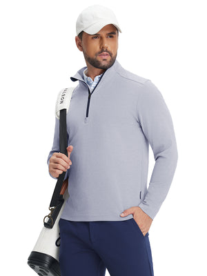 Model wearing two tone pique cotton blend q-zip in navy, hand in pocket with tennis bag