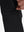 Detail view of design on black flat front golf joggers pants with belt loops