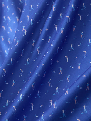 Macro view of the blue golf swing 4 way stretch print collared polo shirt fabric, showcasing the unique print design