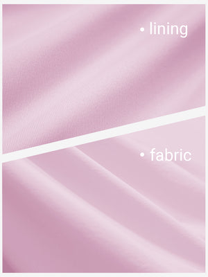 Close-up texture of light pink women's gym golf shorts with liner pocket fabric showing detailed outer and inner lining material.
