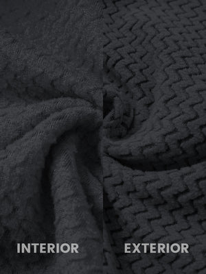 Close-up of the inner and outer fabric of full zip fleece hoodied jacket in black, showing exture and finish