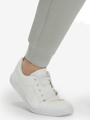 Detail view of hem on silver gray flat front golf joggers pants with belt loops