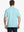 Back half-body shot of model showcasing the back of Sport Fit Stripe Polo in Aqua Blue Stripe