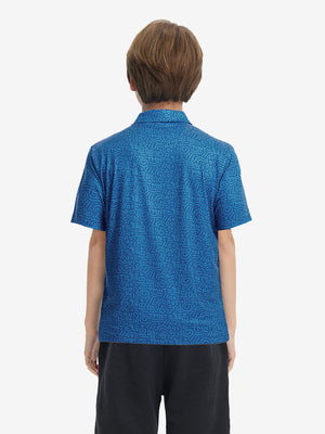 Back half-body view of youth wearing blue graffiti performance print boys golf polo, showing rear design